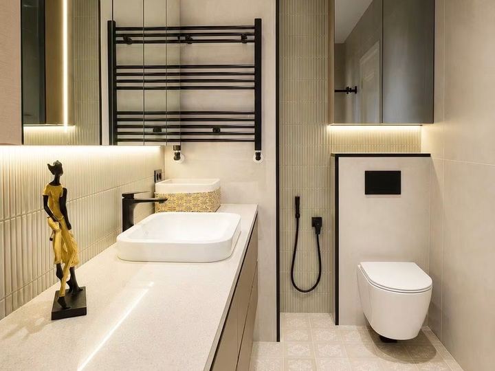 Bathroom with a long vanity, lit shelves, a heated towel rail and a wall-hung toilet - Sani Building Corp