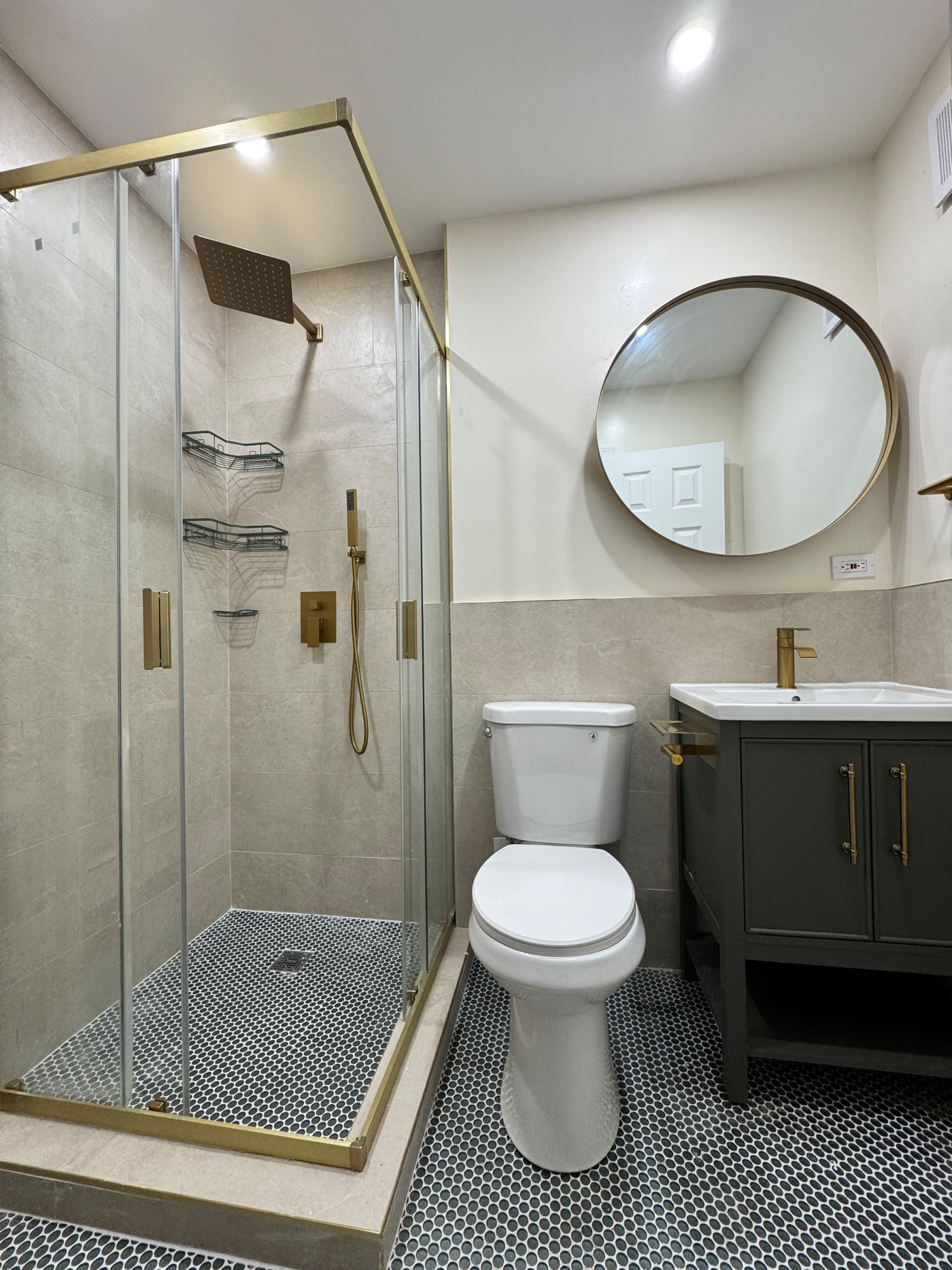Remodeled Brooklyn bathroom with custom tile and walk-in shower by Sani Building Corp