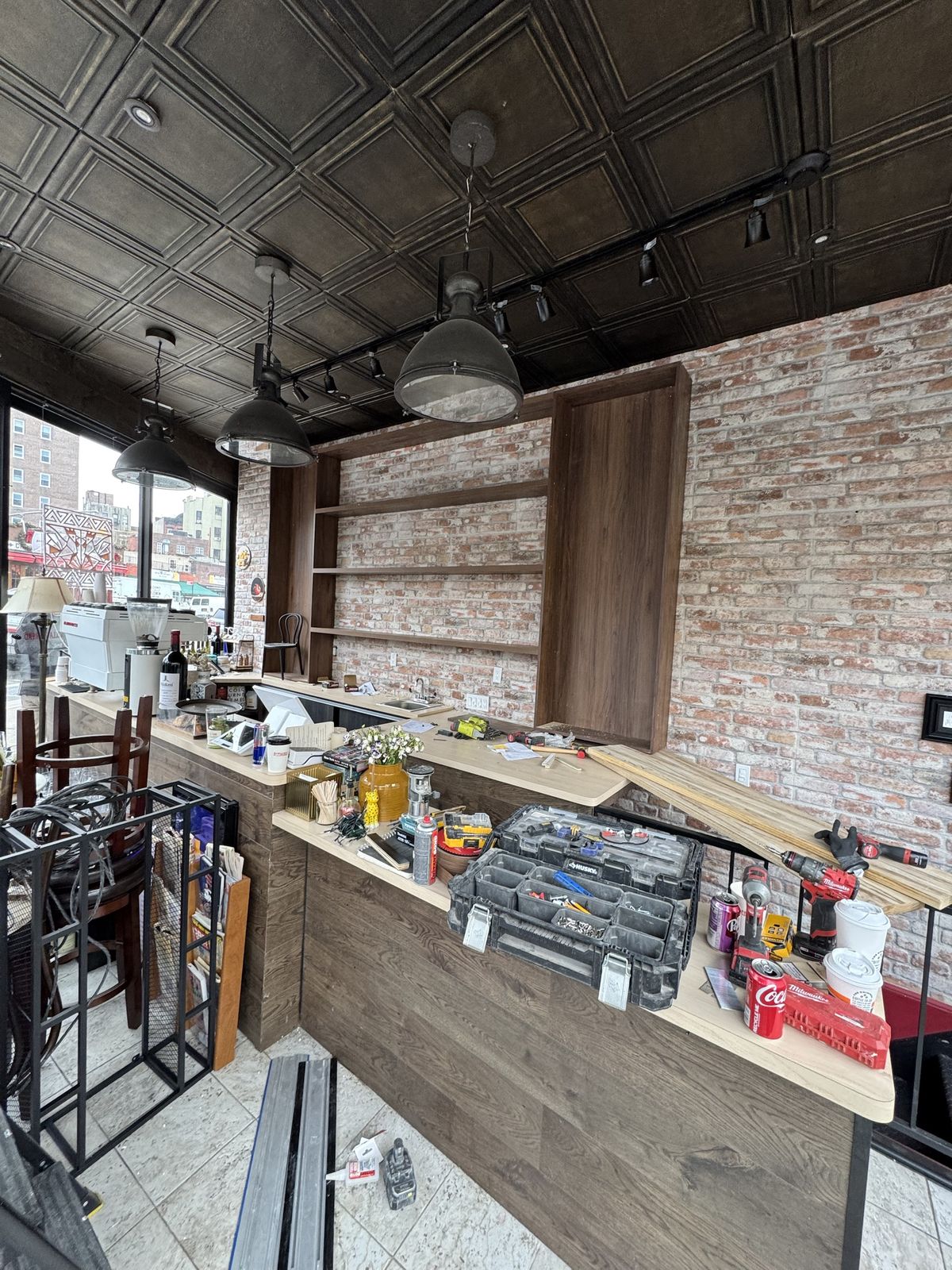 Sani Building Corp carpenters fitting cafe millwork in NYC