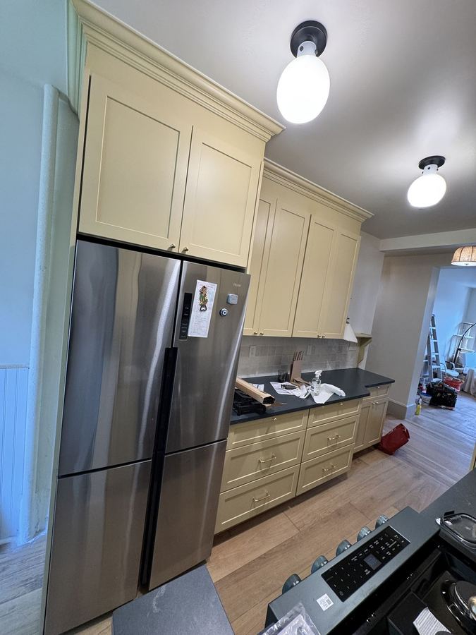 Fridge surround and panels - finish carpentry and millwork by Sani Building Corp