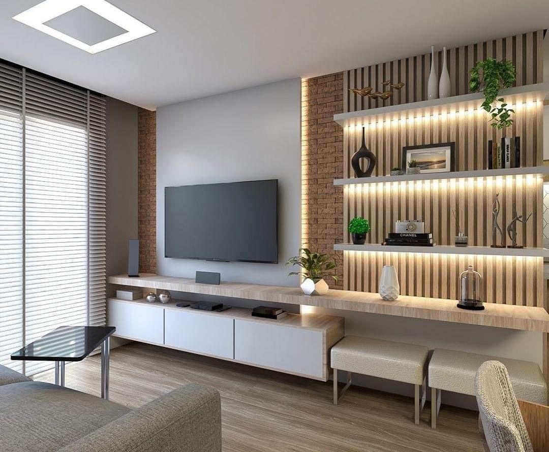 Custom built-in media wall with lit shelving, carpentry and millwork by Sani Building Corp NYC
