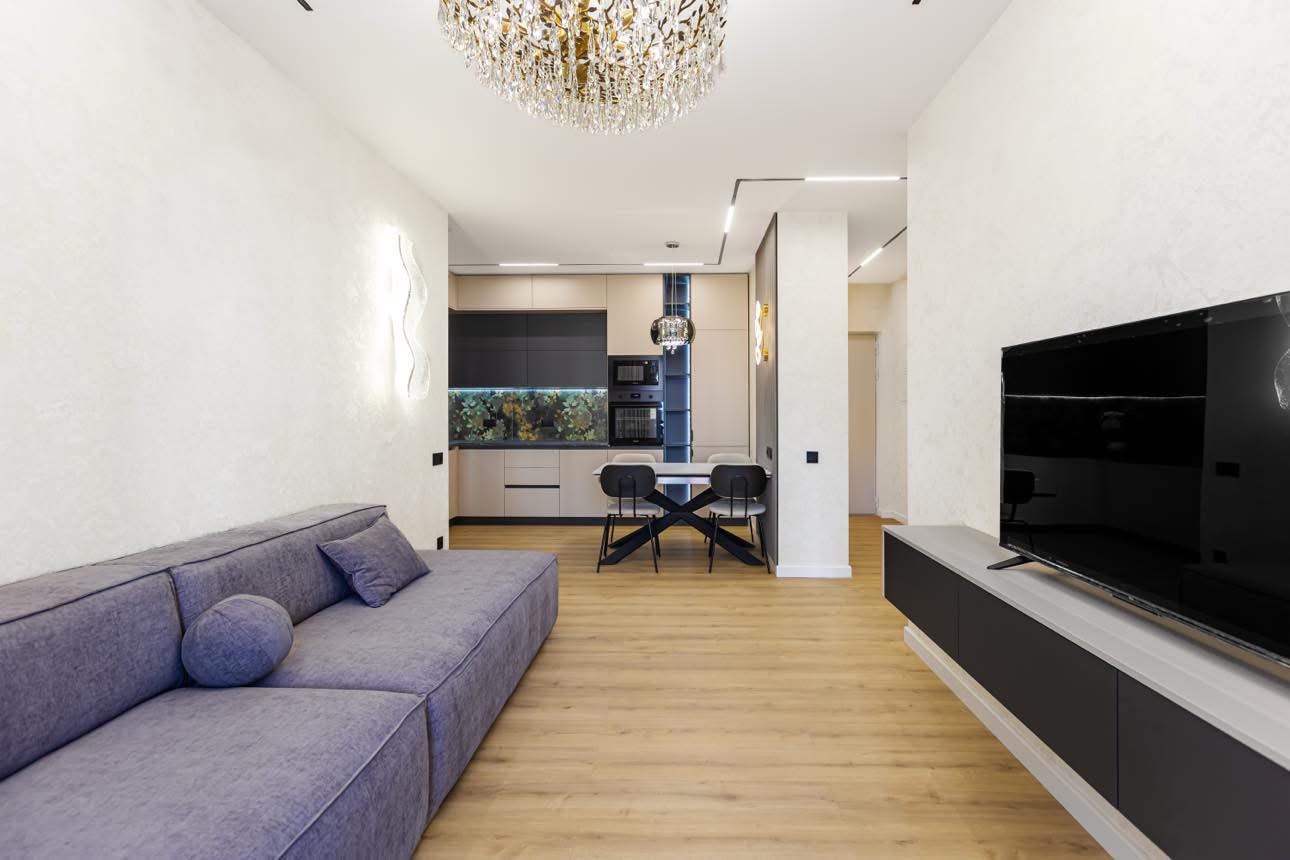 Open concept living space renovation - Sani Building Corp