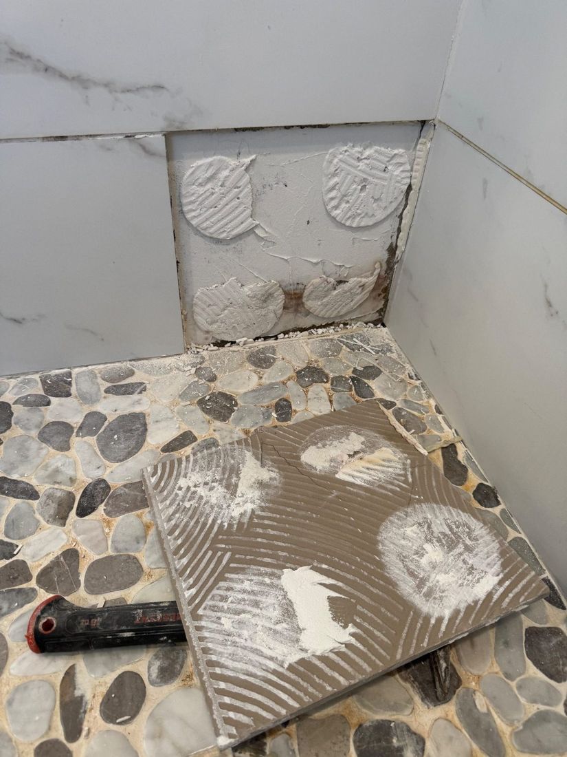 Leaking shower floor opened up for repair in an NYC apartment