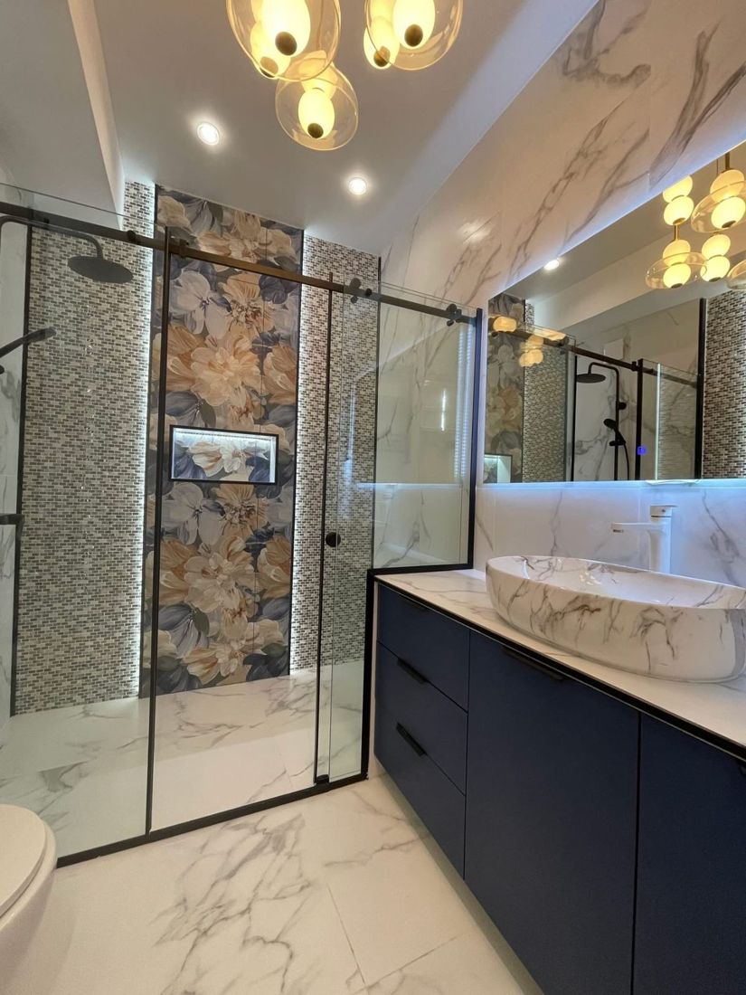 Walk-in shower with glass enclosure after a tub to shower conversion in NYC
